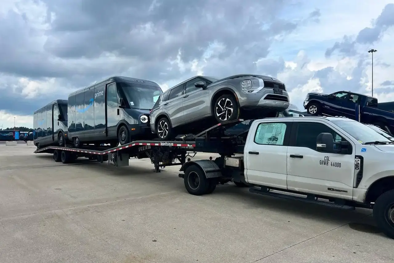IL to FL load — yellow Chevrolet trucks on hotshot trailer
